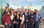 Group photo of Comparative and International Dispute Resolution LLM students on a London balcony.