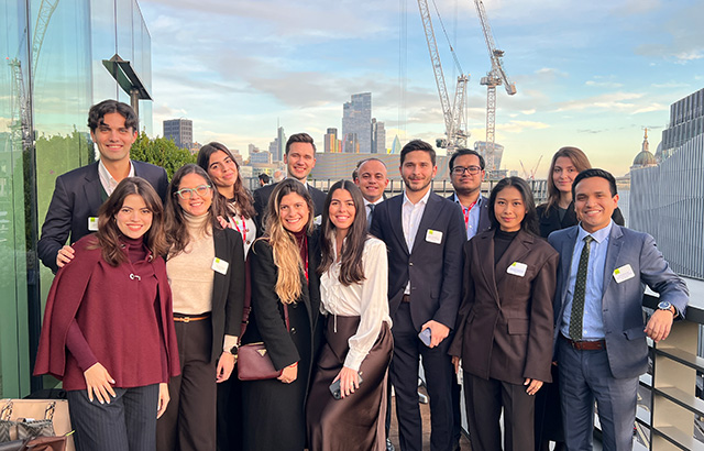 Group photo of Comparative and International Dispute Resolution LLM students on a London balcony.