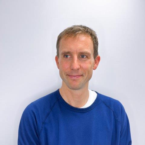 Huw Marsh - A man with sort blond hair and blue top