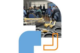 A group of students in a classroom with models of bones and joints