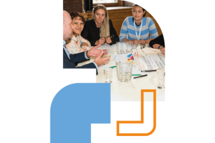 A group of people in discussion around a table