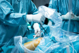 Surgeons operating on a patient