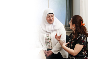 Two women speaking to each other