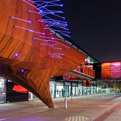 An image of Neuron Pod at night outside the Blizard Institute