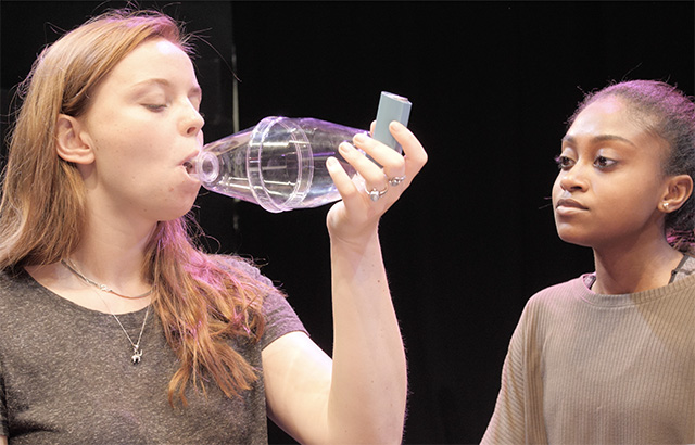 Children using asthma inhaler