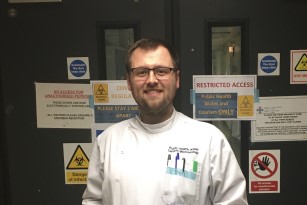 Postgraduate student Benjamin Johns at the Wales Specialist Virology Centre