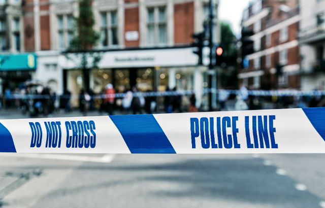 Police tape cordoning off pedestrian crossing