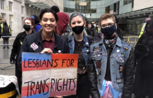 Sarina Allan holding a placard saying 