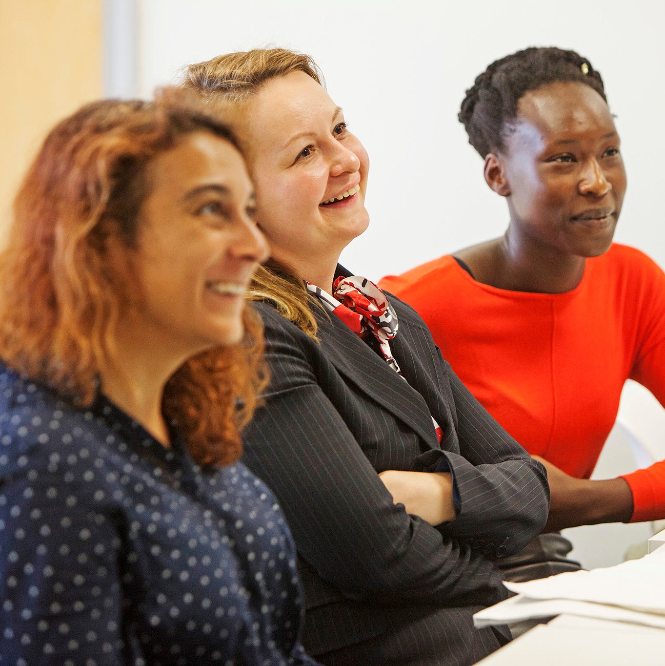 Women sat listening to a presentation