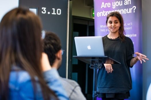 Woman standing in front of computer
