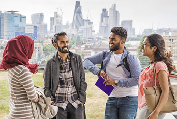 Students at top of grad centre with city backdrop