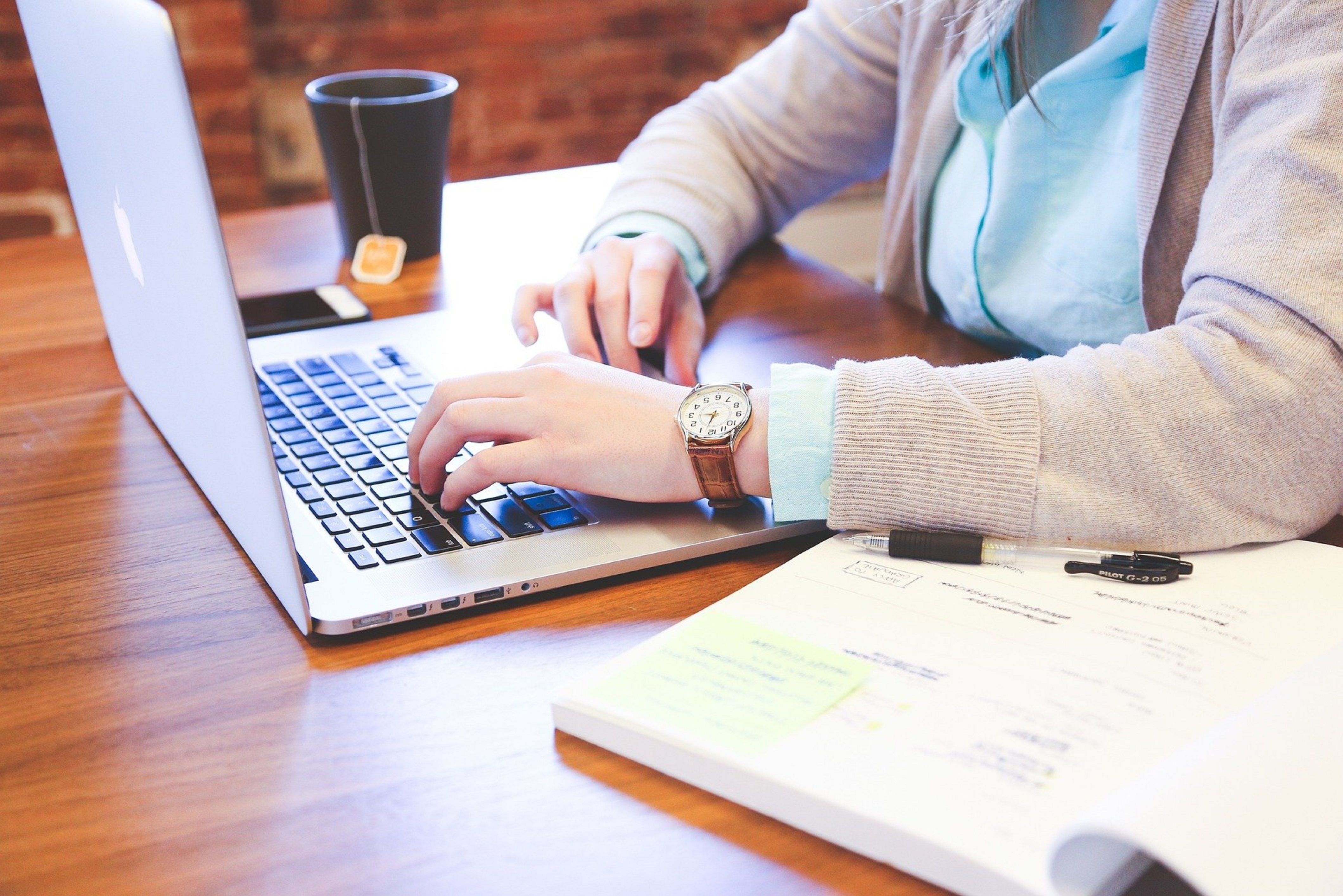 Woman typing on a computer