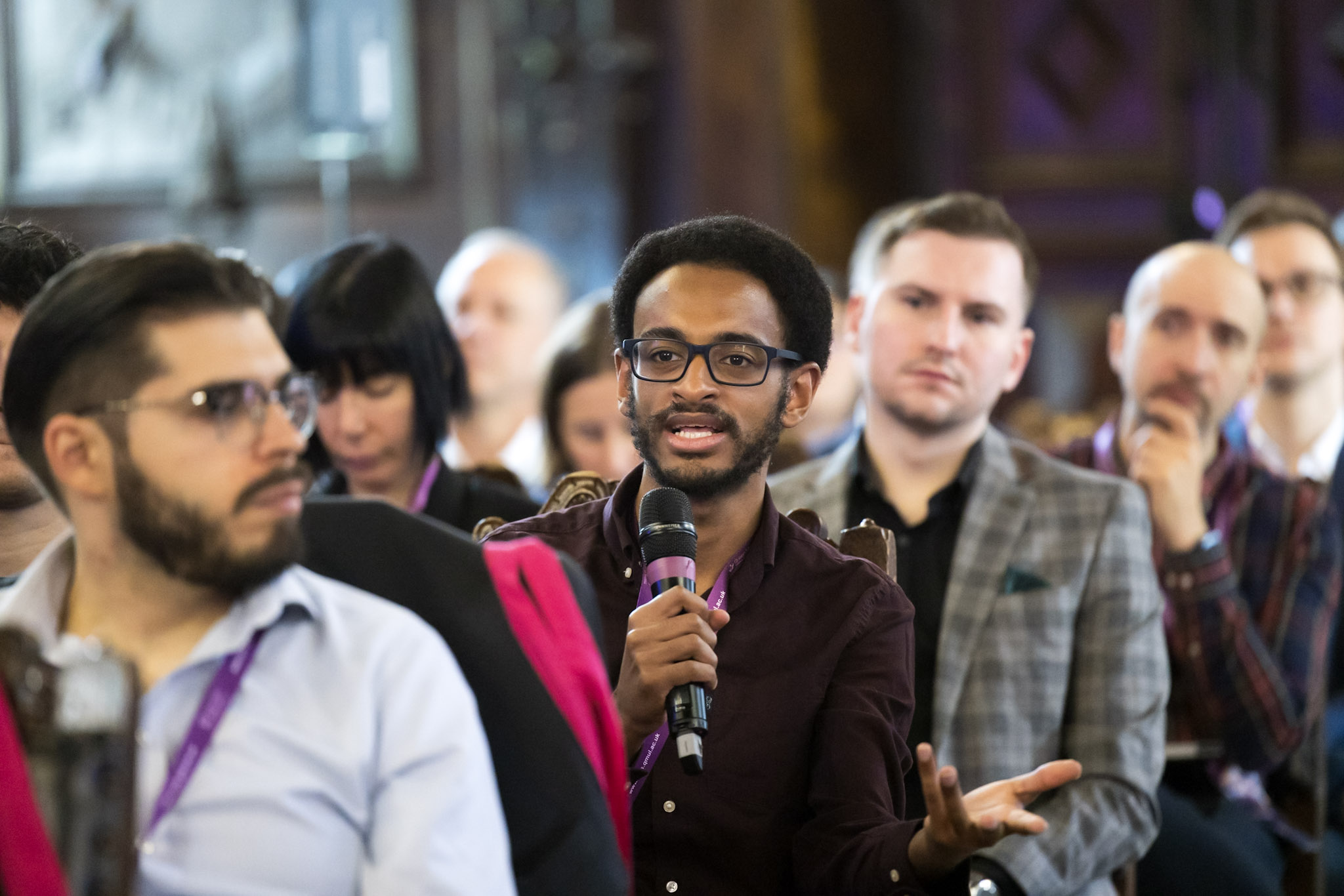 More Than Just a Game 2024 attendee asking a question holding a microphone