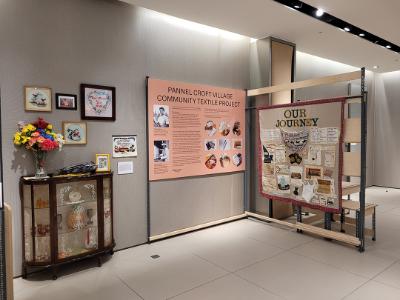 Their journey is displayed on another panel. It is next to a cabinet with artwork displayed in and above it.