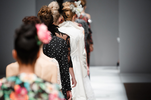 Models walking down a catwalk.