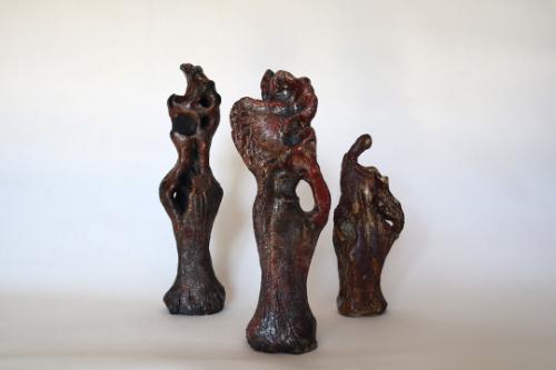 Finished clay statues with a shimmering sand effect.