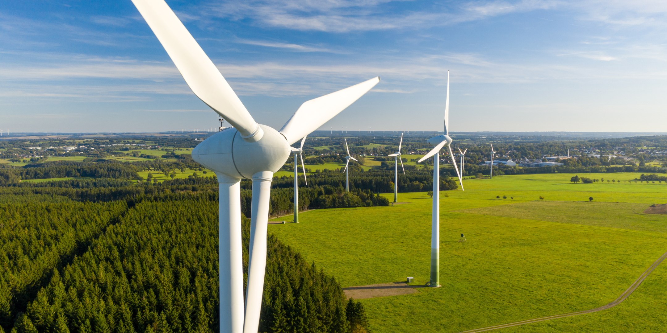 Windmills on a green field