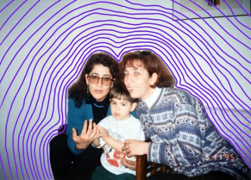 Two women with a small child. They are outlined by a purple boarder, radiating out.