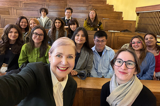 Professor Johanna Gibson with CCLS students at a lecture theatre.