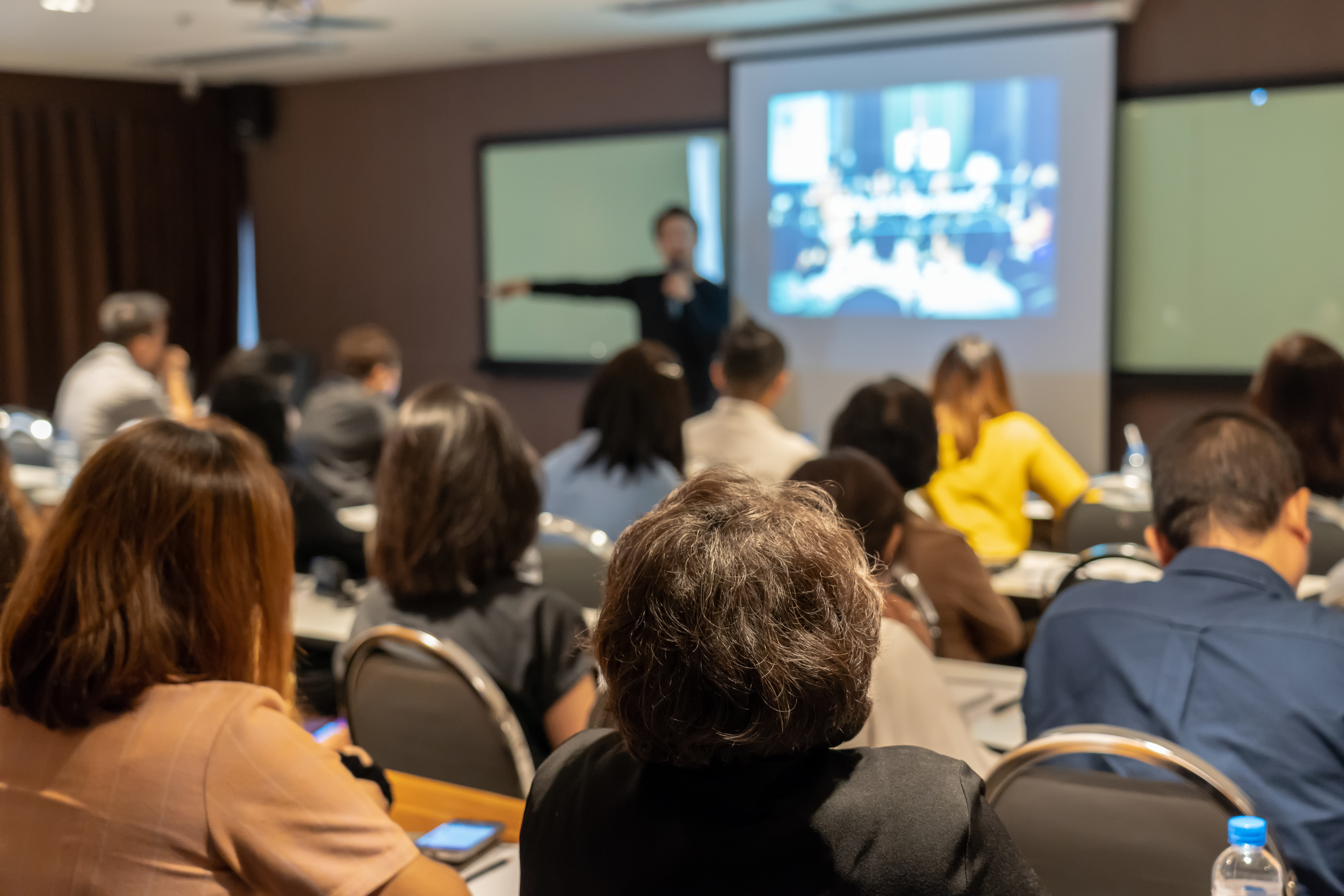 Audience listening to speaker in a classroom