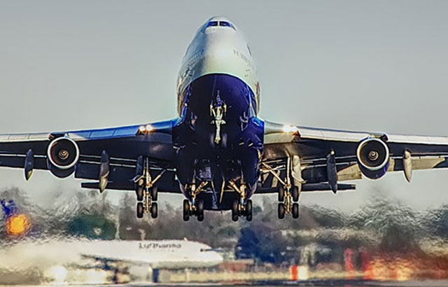 A passenger plane taking off from a runway.
