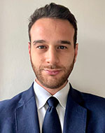 Thomas Lehmann wearing a blue suit and blue tie.