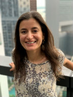 Miriam Goldby standing on a balcony