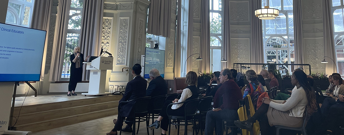 Elspeth giving a lecture at a conference