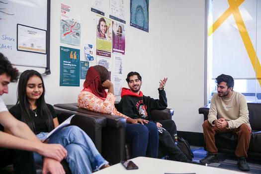 Images of students receiving support from Student Services staff member and interacting with peers. Taken for the Undergraduate Prospectus 2024.