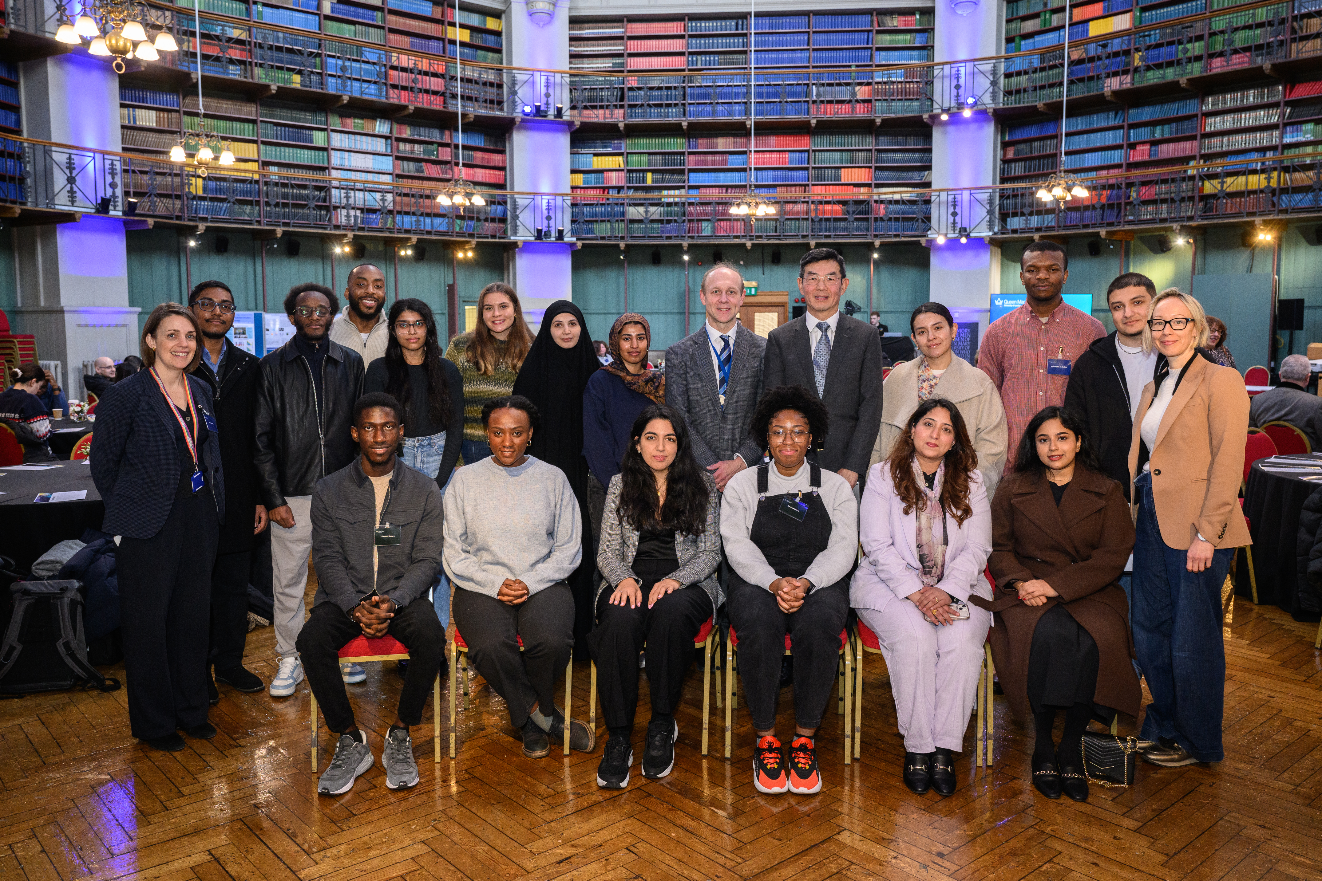 group of students and stakeholders in the Octagon room