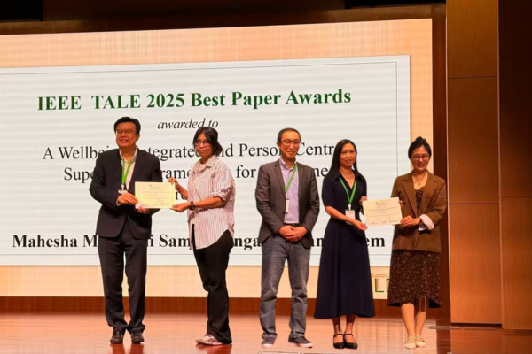 EECS Award winners standing on stage