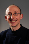 Professor Simon Dixon smiling and looking at camera