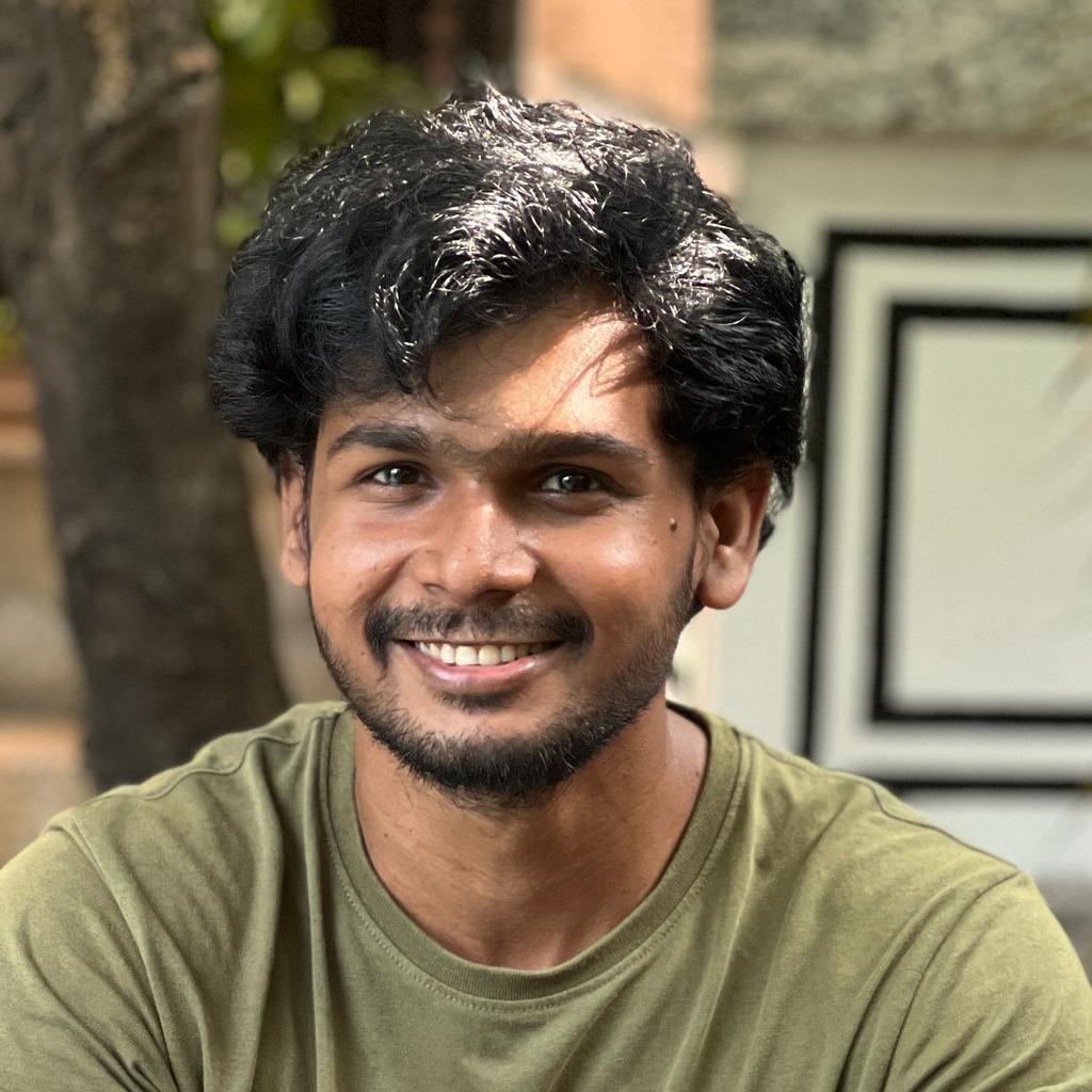 EECS alumni smiling at camera