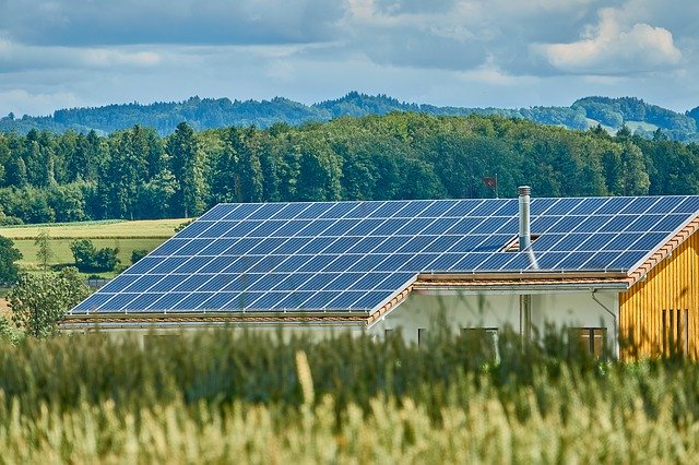 Solar panel on a house in a field