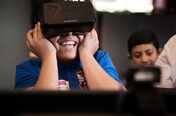 Child looking through virtual reality headset