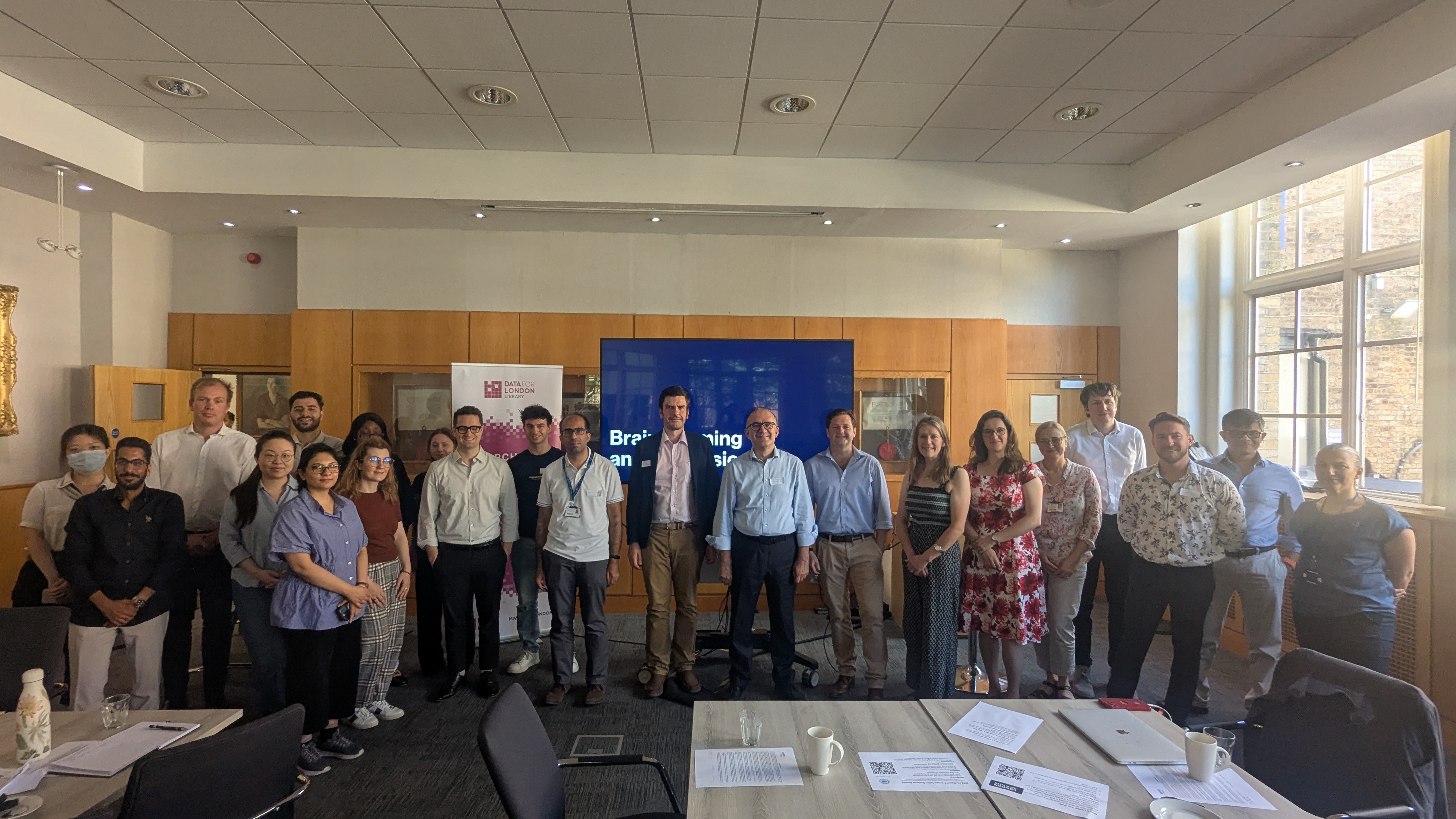 Workshop participants in a group looking at the camera