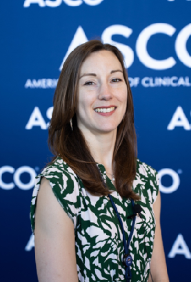 A picture of Alison Berner against a bright blue background