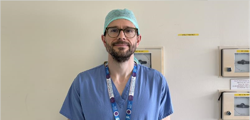 A picture of Edmund Bailey in scrubs