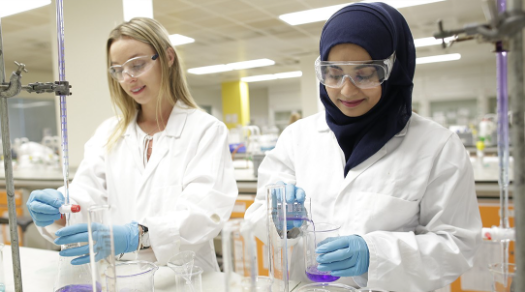 Two female students in a laboratory