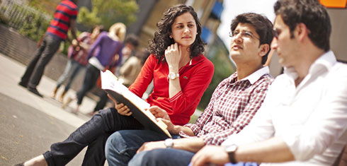 A group of students sitting on a bench