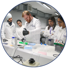 Photo of a group working together in a lab.