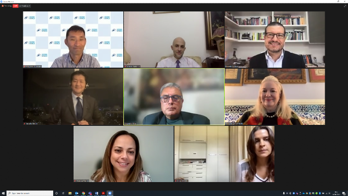 The panel smiles at the camera