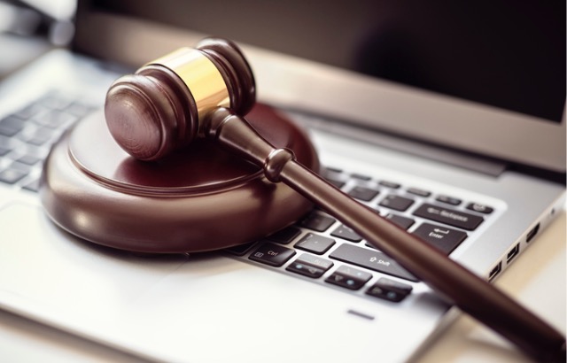 A justice gravel on a laptop keyboard