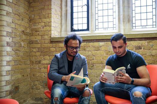 Students talking with books