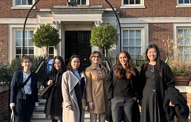 Queen Mary LLM students standing together outside the 3VB offices.