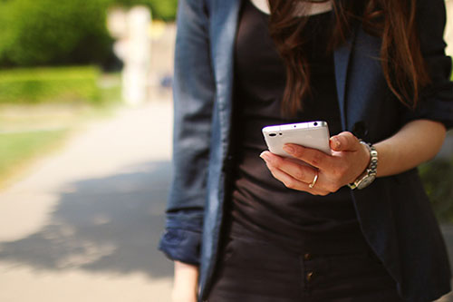 A woman holding a phone