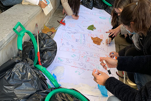 Students writing out the word CHANGE