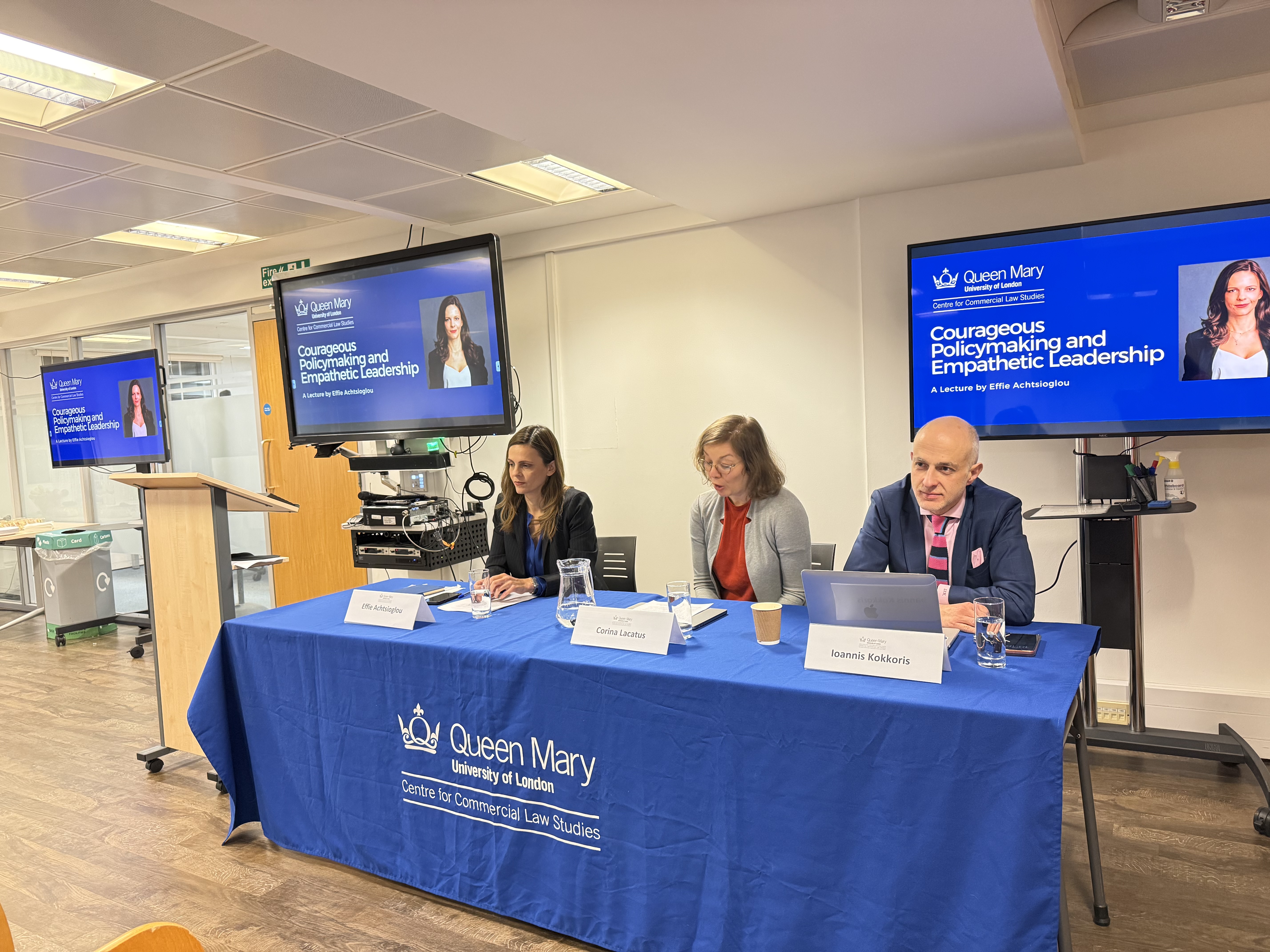 Three speakers sitting on a panel