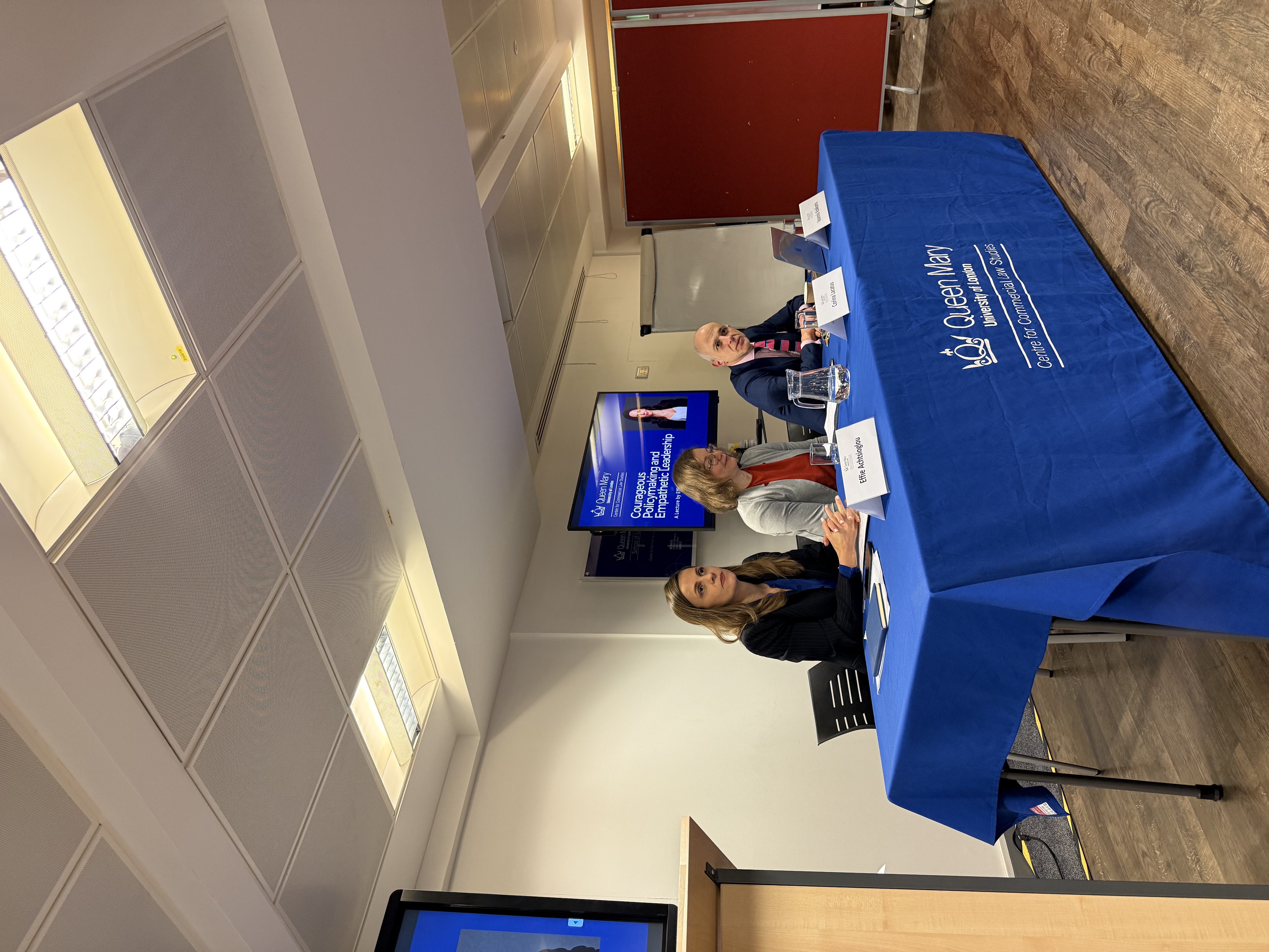 Three speakers sitting on a panel