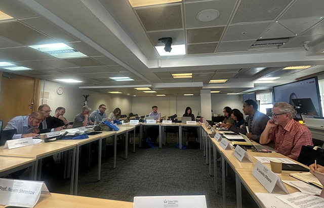 Participants at the QMIPRI evergreening workshop. The desks are arranged so participants are facing inwards.